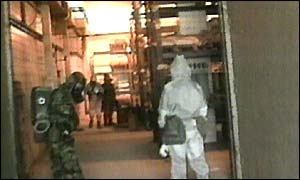 Weapons inspectors search a building in Iraq