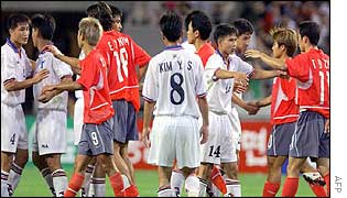 Players hug after the match
