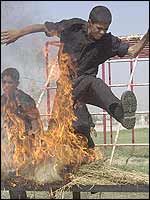 Young Iraqi cadets jump through hoops