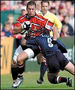 Gloucester's Henry Paul is tackled by Sale's Brian Redpath