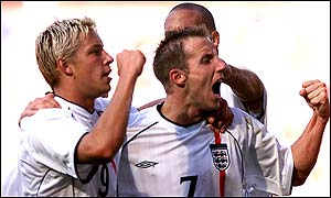 The Leeds duo, plus former Ellland Road man Rio Ferdinand, celebrate Smith's goal