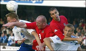 John Hartson battles in the air for the ball 