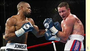 World light-heavyweight champion Roy Jones retained his WBC, IBF and WBA titles against Britain's Clinton Woods