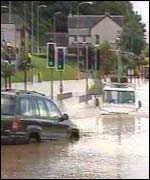 Vehicles on flooded road