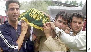 Relatives of slain Kashmiri official Mehta Khan carry his coffin in Srinagar