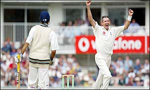 Caddick gets England's only scalp of the morning as Laxman is caught by Ashley Giles
