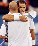 Anadre Agassi hugs Pete Sampras at the net after the latter's victory