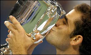 Pete Sampras kisses the US Open trophy after victory over Andre Agassi