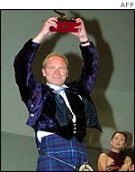 Peter Mullan receiving the Golden Lion at the Venice film festival