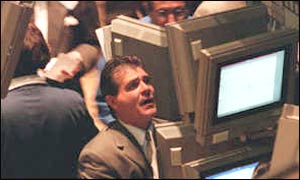 Trader watching stock market board