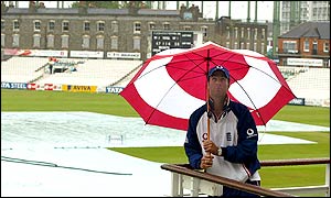 Michael Vaughan looks up at the grey skies above The Oval