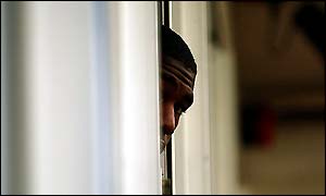 England's Alex Tudor peeks out of the dressing room door
