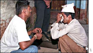 Sambhu Raut, brother of one of police officers killed by Maoist rebels, cries after his brother's funeral at Pashupati temple in Katmandu