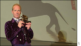 Peter Mullan holds his Golden Lion