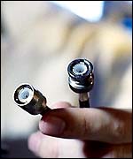 Man holding cables (Eyewire)