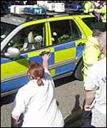 Protester throws eggs at police convoy