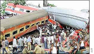 Police officers guard passengers' belongings 