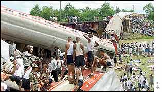 Rescue workers search the wreckage 