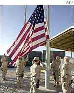 Soldiers raise the US flag at Bagram