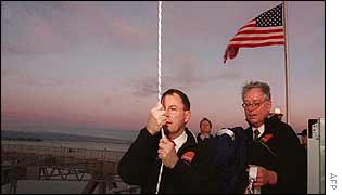 The Stars and Stripes is raised over Auckland harbour bridge