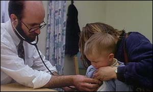 A GP examines a child 