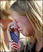 American Amanda Worrell cries during the service
