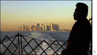 A Hispanic man looks at the New York skyline