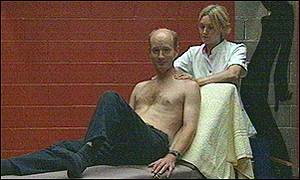 It's a tough job! Simon gets a massage from Tina