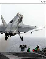 An F18 takes off from the USS George Washington