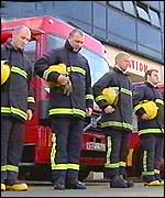 Firefighters observe a minute's silence