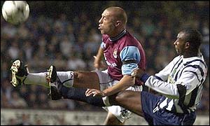 West Brom goalscorer Jason Roberts challenges West Ham's Tomas Repka. 