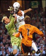 Swansea's Jamie Wood challenges Wolves keeper Michael Oakes