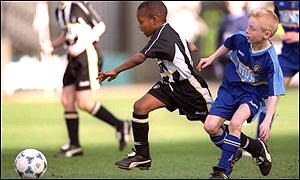 Youngsters playing football generic