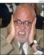 Saeb Erekat holding his ears