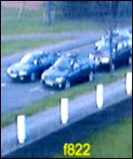 The dark saloon is shown travelling down Station Avenue