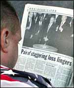 New Yorker reading coverage of 9/11 anniversary