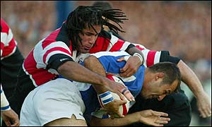 Pontyrpidd's Richard Parks tackles Shaun van Rensburg of Brigdend