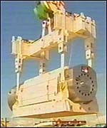 Nuclear fuel container being lifted