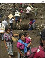 Villagers bring supplies 