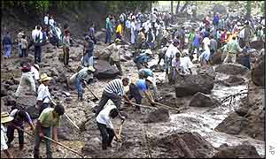 Rescuers comb through the mud for survivors 