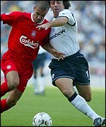 Premiership debutants Milan Baros of Liverpool and Bolton's Ivan Campo