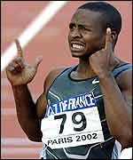 Tim Montgomery breaks the 100m world record