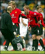 Manchester United's Nicky Butt limps off against Leeds on Saturday