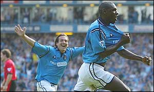 Shaun Goater (right) and Eyal Berkovic celebrate City's equaliser