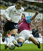 West Ham's Edouard Cisse tackles Simon Davies of Spurs