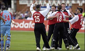 Glamorgan celebrate the prized wicket of Australia star batsman Steve Waugh