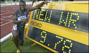 Tim Montgomery celebrates his world record in Paris