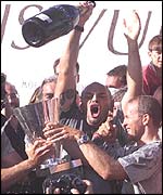 Prada hold aloft the Louis Vuitton Cup after beating AmericaOne in the last race of the Louis Vuitton finals 