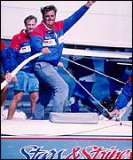 Skipper Dennis Conner of the Stars and Stripes displays a thumbs-up sign after winning race two of the America's Cup in San Diego, California