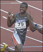 Tim Montgomery celebrates his world record